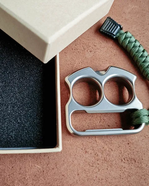 Kraft paper box and paracord knot available as paid options | Paper bag by default